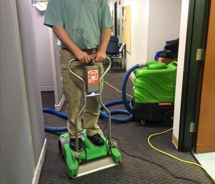 SERVPRO tech extracting water from a carpet in Acworth, GA.