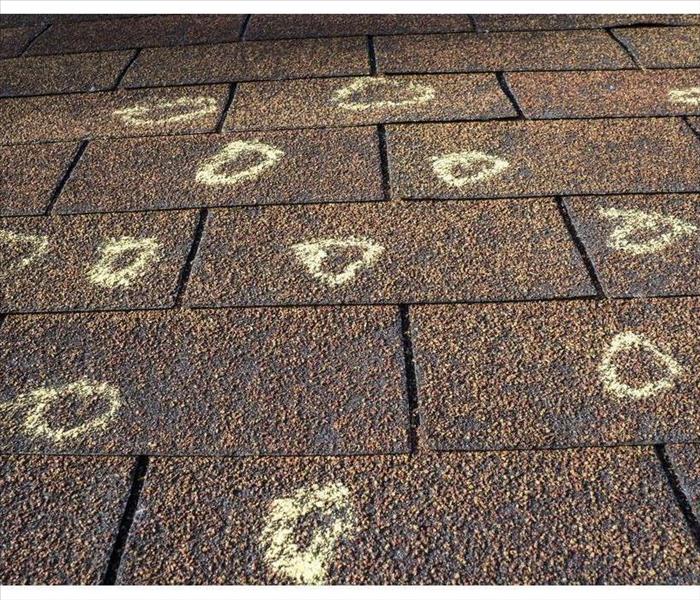 Circles on a roof with chalk, hail damage on a roof